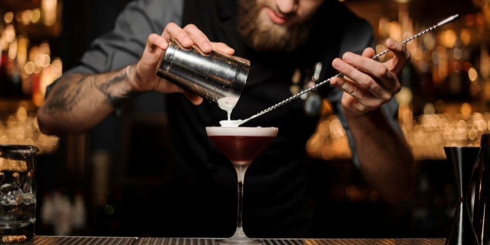 Bartender making a cocktail.
