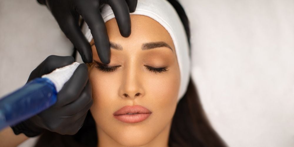 Woman getting permanent make-up.
